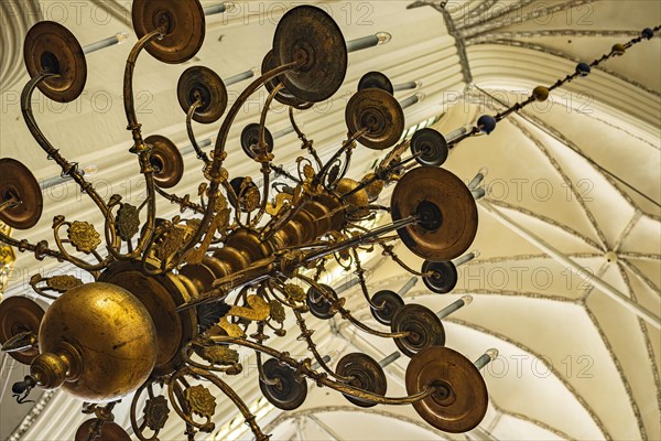 Chandelier hanging from the vault, interior view of St Mary's Church in the historic old town of Rostock, Mecklenburg-Western Pomerania, Germany, Europe