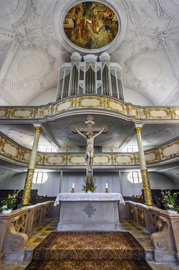 Altar with crucifix and organ loft, Dreifaltigkeitskirche, Kaufbeuern, Allgaeu, Swabia, Bavaria, Germany, Europe