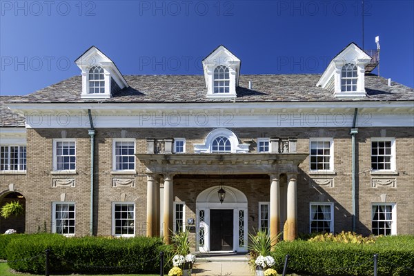 Saugatuck, Michigan, The Felt Mansion. Built as a summer home for Dorr and Agnes Felt in the 1920s, the 12, 000 square foot house has 25 rooms and a ballroom on three floors. The restored building is now used for special events. Felt became a millionnaire after inventing the Comptometer, which performed basic math functions