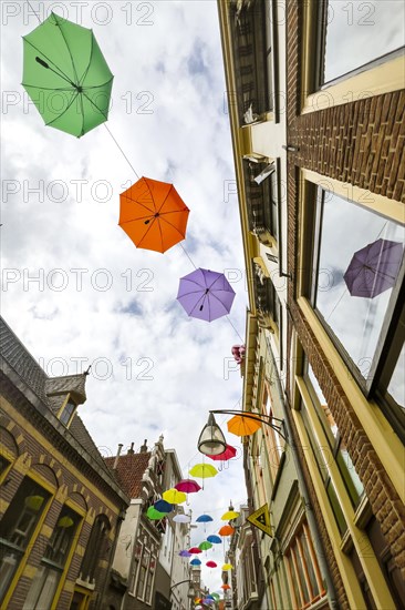 Colourful colourful umbrellas in the city centre, centre, jewellery, decorated, decoration, festive, umbrella, colourful, joyful, atmosphere, urban, design, hanging, hanging, travel, city trip, tourism, shopping, shopping, home, architecture, Dutch, creative, Deventer, Netherlands