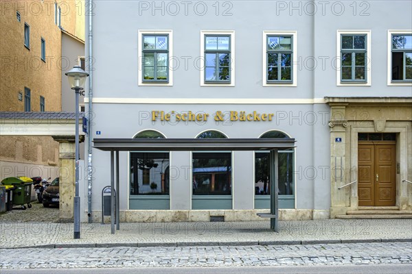 Butcher and baker in one, that's rare, exterior view of a house with the shop sign butcher & Baecker in a row of houses in the city centre of Weimar, Thuringia, Germany, as at 13 August 2020, Europe