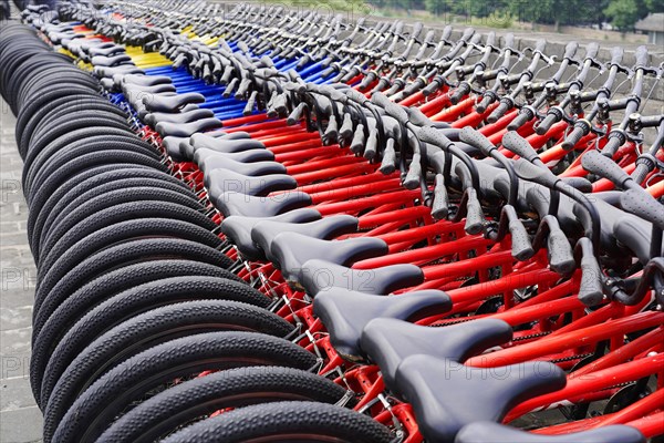 Rental bicycles, Xian, Shaanxi, China, Asia, Orderly rows of bicycles with red frames in a public place, Xian, Shaanxi Province, China, Asia
