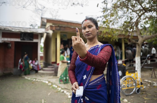 BOKAKHAT, INDIA, APRIL 19: A women show her marked finger after casting vote during the first phase of the India's general elections on April 19, 2024 in Bokakhat, Assam, India. Nearly a billion Indians vote to elect a new government in six-week-long parliamentary polls starting today