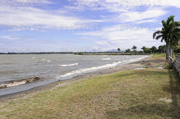 Granada, Nicaragua, A boardwalk overlooking the beach and undulating waters, Central America, Central America