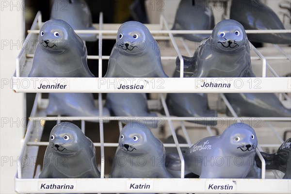 Sylt, North Frisian island, Schleswig-Holstein, ceramic seal figurines on a shelf, each labelled with a name, Sylt, North Frisian island, Schleswig-Holstein, Germany, Europe