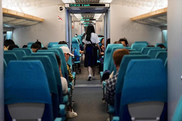 Shanghai Transrapid Maglev Shanghai maglev train stop train station station, Shanghai, China, Asia, View through the aisle in the high-speed train, passengers sitting and walking, Asia