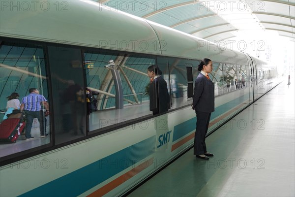 Shanghai Transrapid Maglev Shanghai Maglev Train Station Station, Shanghai, China, Asia, People boarding a train on a modern platform in the city centre, Asia