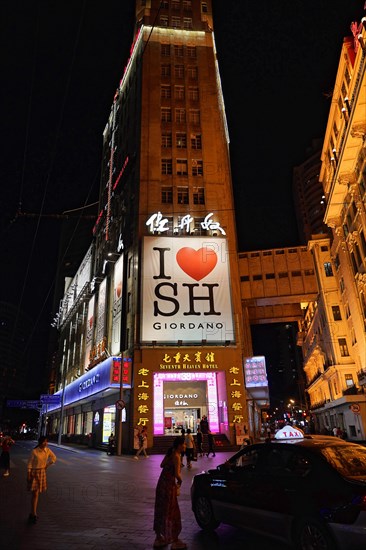 Evening stroll through Shanghai to the sights, Shanghai, Illuminated building facade with billboards at night, Shanghai, People's Republic of China