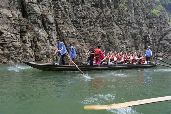 Special boats for the side arms of the Yangtze, for river cruise ship tourists, Yichang, China, Asia, Boat with rowers and passengers near steep cliffs, Hubei province, Asia