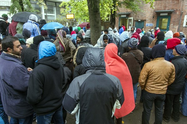 Syrian refugees wait for their registration in cold and wet weather at the Berlin State Office for Health and Social Affairs, 15 October 2015, Berlin, Berlin, Germany, Europe