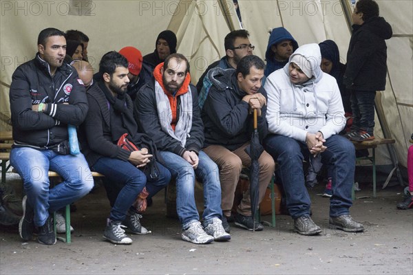 Syrian refugees wait for their registration in cold and wet weather at the Berlin State Office for Health and Social Affairs, 20 October 2015, Berlin, Berlin, Germany, Europe