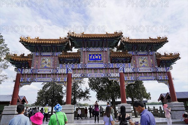 New Summer Palace, Beijing, China, Asia, People walk through a magnificent gate of traditional Chinese architecture, Beijing, Asia