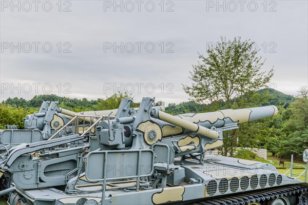 Side view of gun and controls of military tank on display in public park in Nonsan, South Korea, Asia