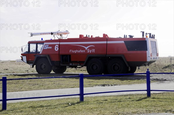 Sylt Airport, Sylt, North Frisian Island, Schleswig-Holstein, Red fire engine on an airport site for emergency standby, Sylt, North Frisian Island, Schleswig-Holstein, Germany, Europe