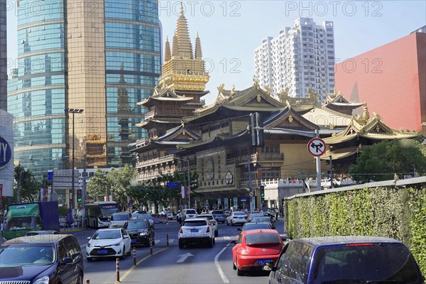 Traffic in Shanghai, Shanghai Shi, People's Republic of China, A mix of traditional and modern architecture on the side of a busy city street, Shanghai, China, Asia