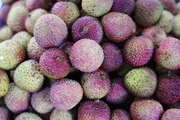 Shanghai, China, Asia, Close-up of lychees with detailed texture on a market stack, People's Republic of China, Asia