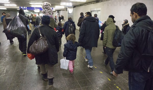 Refugees have arrived at Schoenefeld station on an IC train. They are then taken by bus to accommodation in Berlin, 02.12.2015, Schoenefeld, Brandenburg, Germany, Europe