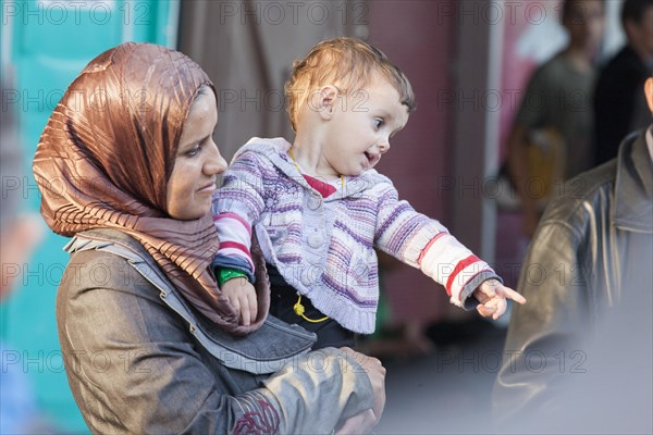 Syrian refugees have arrived at Schoenefeld station on a special train. They are then taken by bus to accommodation in Berlin, 13/09/2015, Schoenefeld, Brandenburg, Germany, Europe