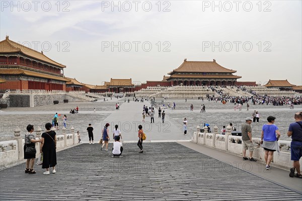 China, Beijing, Forbidden City, UNESCO World Heritage Site, Overview of the extensive square in the Forbidden City with visitors and historic buildings, Asia
