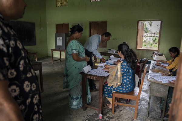 BOKAKHAT, INDIA, APRIL 19: Voters at a polling station to cast their votes during the first phase of the India's general elections on April 19, 2024 in Bokakhat, Assam, India. Nearly a billion Indians vote to elect a new government in six-week-long parliamentary polls starting today