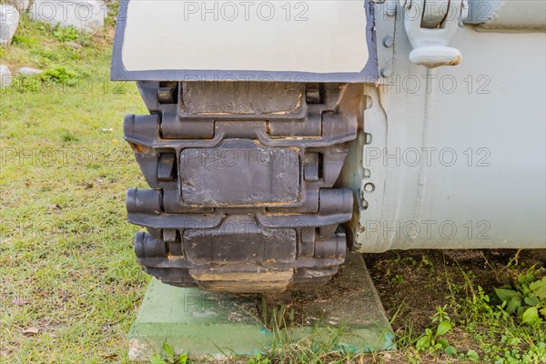 Closeup of metal tracks on military tank at public military history park in Nonsan, South Korea, Asia