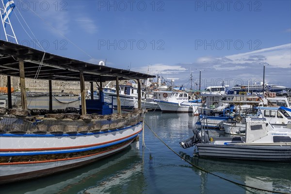 Boats anchoring in Kolona harbour in front of the city wall, Rhodes, Dodecanese archipelago, Greek islands, Greece, Europe