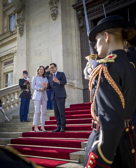 Annalena Baerbock (Alliance 90/The Greens), Federal Foreign Minister, takes a photo as part of her participation in the international humanitarian conference on Sudan and its neighbouring countries. Here she is greeted by Stephane Sejourne, Foreign Minister of France, at the Quai d'Orsay Foreign Ministry. 'Photographed on behalf of the Federal Foreign Office'