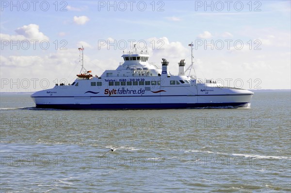 Sylt, Schleswig-Holstein, A ferry of the Sylt ferry fleet glides over a calm sea under a clear blue sky, Sylt, Schleswig-Holstein, Germany, Europe