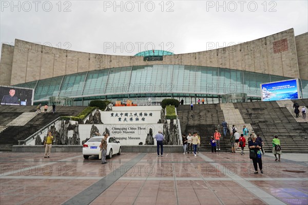 Chongqing, Chongqing Province, China, Asia, Visitors walk towards the stairs of a modern museum with an eye-catching roof, Asia