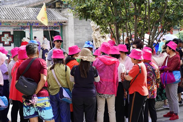 New Summer Palace, Beijing, China, Asia, A group of tourists in eye-catching clothes on a sightseeing tour, Beijing, Asia