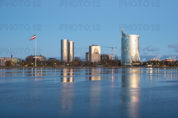 Swedbank headquarters, building reflections on the water, Daugava River, Riga, Latvia, Europe