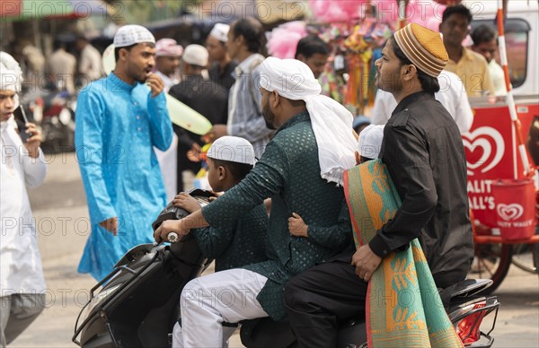 GUWAHATI, INDIA, APRIL 11: Muslim people with children walk towards an Eidgah to perform Eid Al-Fitr prayer in Guwahati, India on April 11, 2024. Muslims around the world are celebrating the Eid al-Fitr holiday, which marks the end of the fasting month of Ramadan