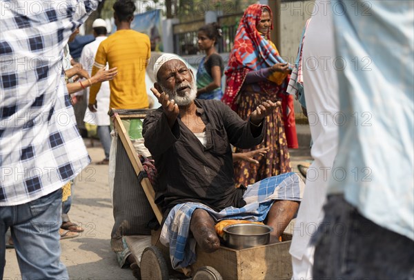 GUWAHATI, INDIA, APRIL 11: A beggar asking for money during Eid al-Fitr in Guwahati, India on April 11, 2024. Muslims around the world are celebrating the Eid al-Fitr holiday, which marks the end of the fasting month of Ramadan