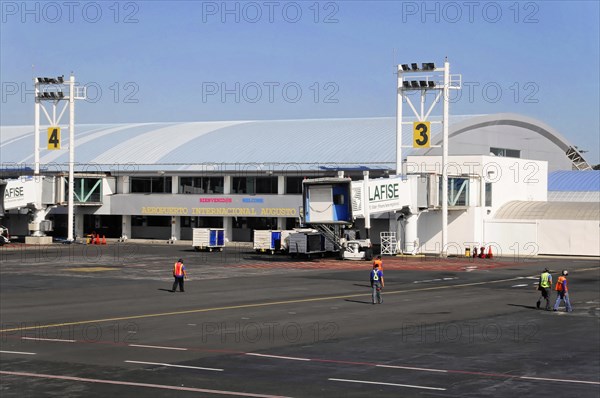 AUGUSTO C. SANDINO Airport, Managua, Overview of the airport terminal with aircraft bridges and airport personnel, Nicaragua, Central America, Central America