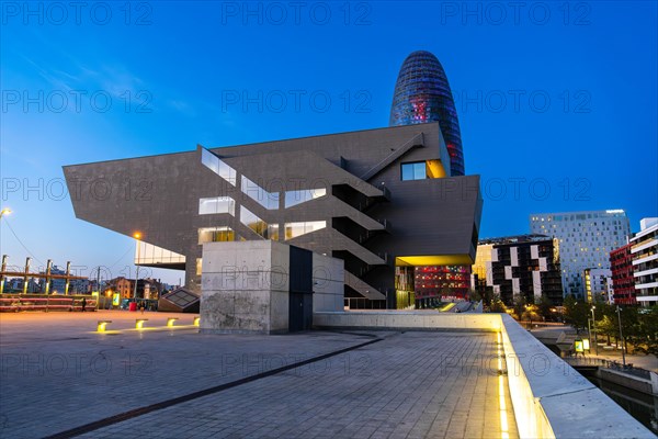 The Torre Glories office building and the Disseny Hub museum at blue hour n Barcelona, Spain, Europe