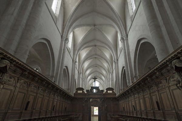 Oak choir stalls, 17th century, and ribbed vault in the former Cistercian monastery of Pontigny, Pontigny Abbey was founded in 1114, Pontigny, Bourgogne, France, Europe