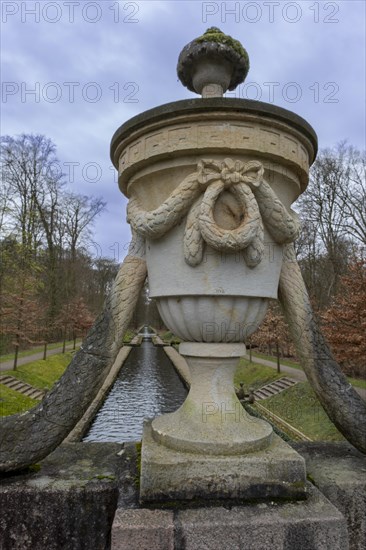 View from a stone bridge with an ornamental vase onto a canal in the castle park, Ludwigslust, Mecklenburg-Vorpommern, Germany, Europe