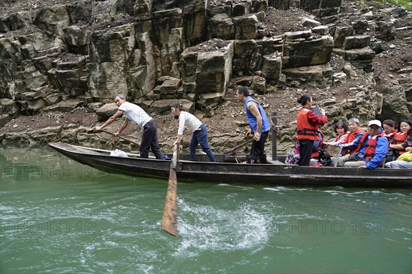 Special boats for the side arms of the Yangtze, for the tourists of the river cruise ships, Yichang, China, Asia, Boat rowers working on the banks of a river with passengers on board, Hubei province, Asia