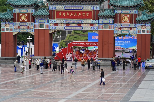 Chongqing, Chongqing Province, China, Asia, Crowds of people move towards a magnificent Chinese temple during a traditional holiday, Asia