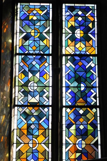 Kaysersberg, Alsace Wine Route, Alsace, Departement Haut-Rhin, France, Europe, Colourful stained glass window with symbolic patterns in a church, Europe