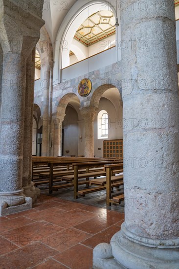 Aisle of an old church with stone benches and columns, Bad Reichenhall, Bavaria, Germany, Europe