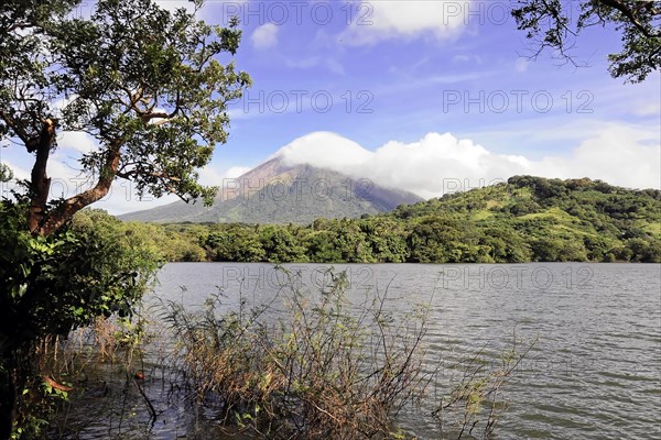 Ometepe Island, Nicaragua, Impressive volcano view over a lake surrounded by green vegetation, Central America, Central America