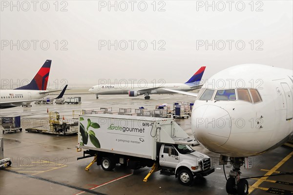 AUGUSTO C. SANDINO Airport, Managua, Nicaragua, Catering vehicle from Gate Gourmet delivers service to a Delta Airlines aircraft, Central America, Central America