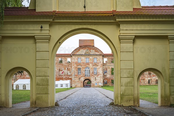Yellow Gate, Dargun Castle and Monastery, in its present form dating back to the late 17th century, in the eponymous town of Dargun, Mecklenburg Lake District, Mecklenburg-Western Pomerania, Germany, state 5 August 2019, Europe