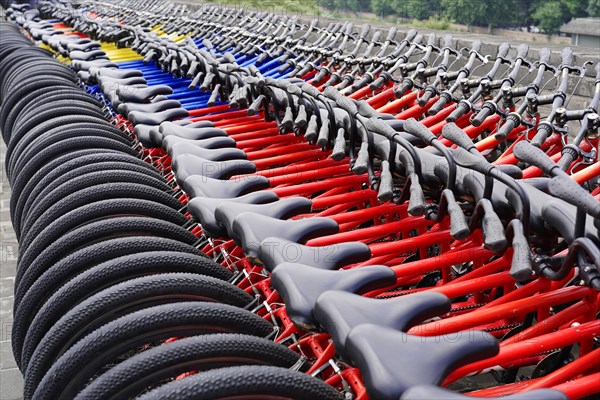 Rental bicycles, Xian, Shaanxi, China, Asia, Orderly rows of bicycles with red frames in a public place, Xian, Shaanxi Province, China, Asia