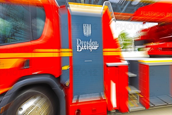 Close-up of a part of a fire engine with the coat of arms of Dresden