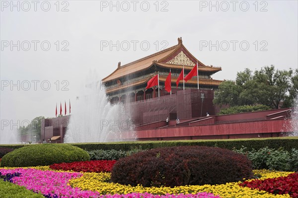 China, Beijing, Forbidden City, UNESCO World Heritage Site, visitors at a historical site with fountains surrounded by flower arrangements, Asia
