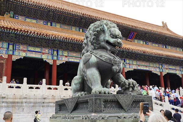 China, Beijing, Forbidden City, UNESCO World Heritage Site, A traditional stone sculpture of a lion in front of the Imperial Palace, Asia