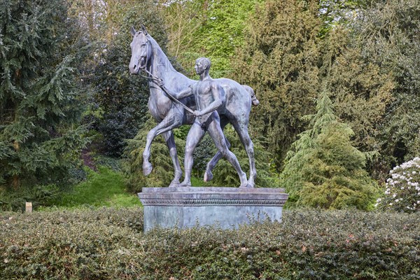 Bronze sculpture The Horse Steer by the sculptor Louis Tuaillon in the Wallanlagen Park in Bremen, Hanseatic City, Federal State of Bremen, Germany, Europe