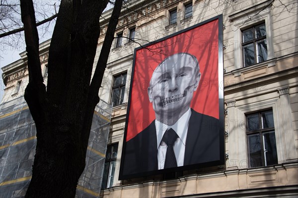 Vladimir Putin as a skull looking at the Russian embassy in Riga, Latvia, Europe